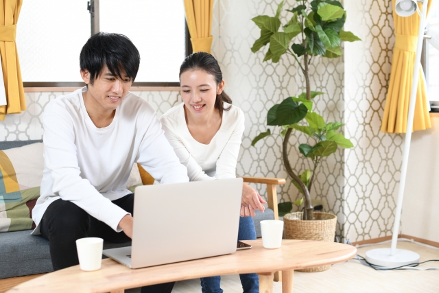 Two people enjoying online shopping