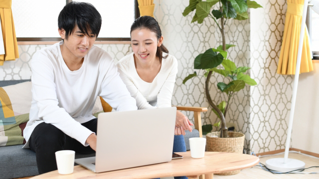 Two people enjoying online shopping