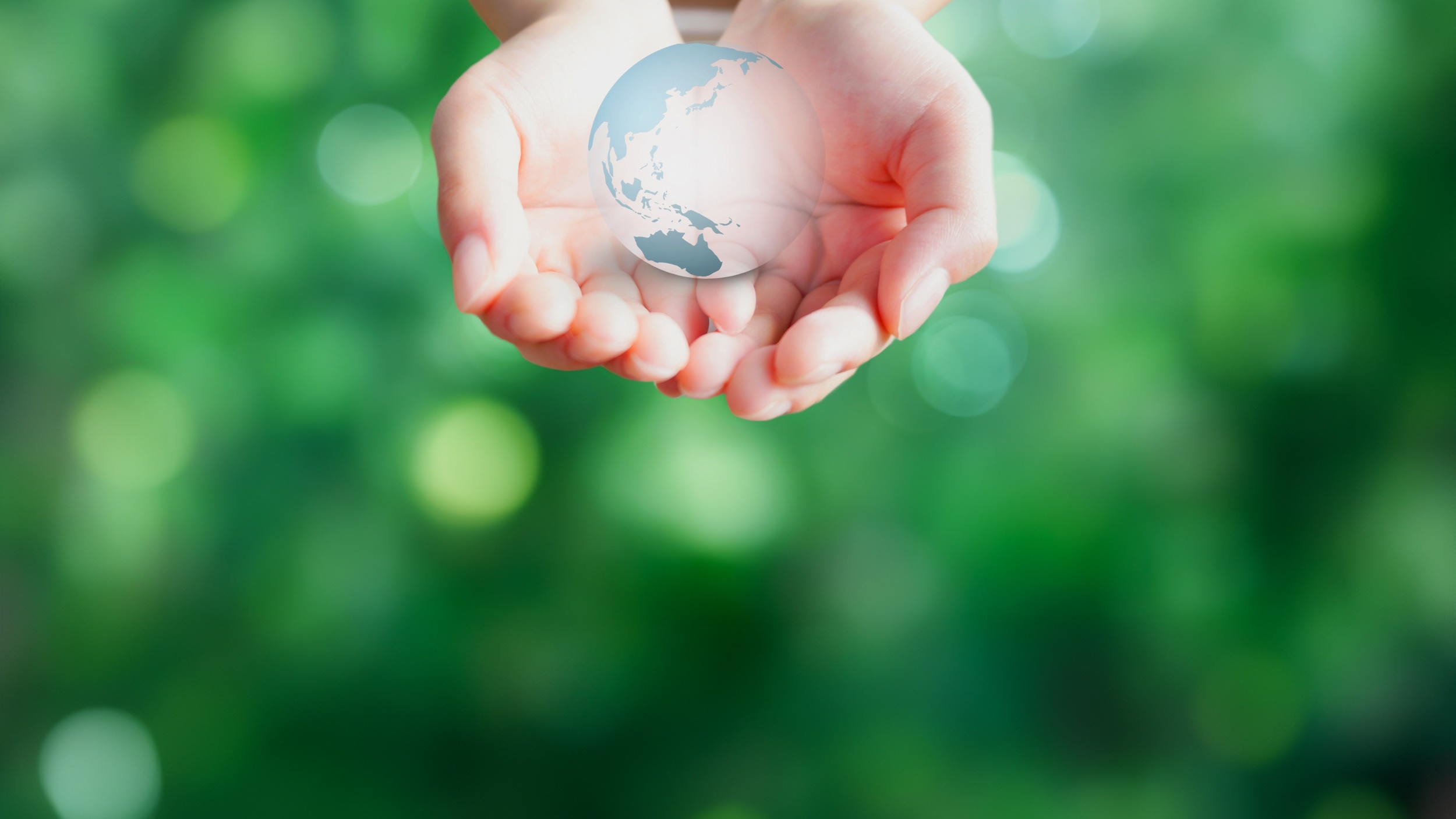 A gentle image of holding the earth in your hands